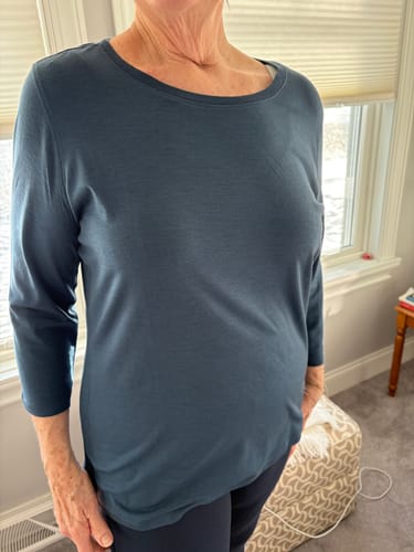 Reviewer wearing the blue Jenny 3/4 Sleeve Crew Neck shirt, showing the fit and length.