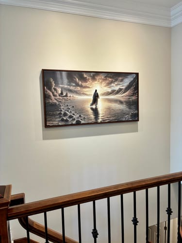 Customer's 'Walking on Water - Faith Wall Art II' canvas hanging on a wall above a home staircase.