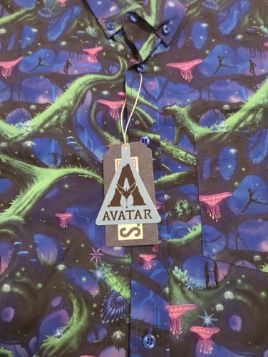 Customer's close-up of the Avatar "Na’vi Nights" shirt, showing the vibrant pattern of Pandora's bioluminescent landscape.