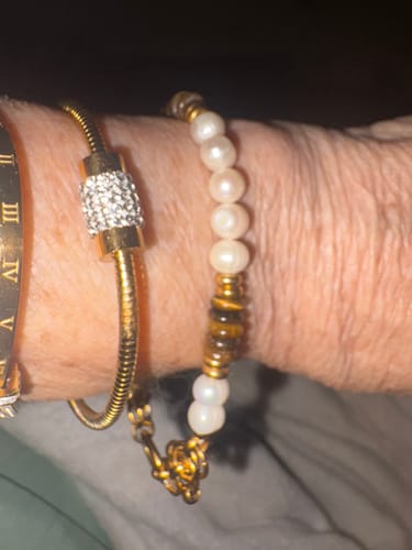 Customer wearing the gold Barrel Clasp Snake Chain Bracelet, showing the sparkling barrel clasp on their wrist.