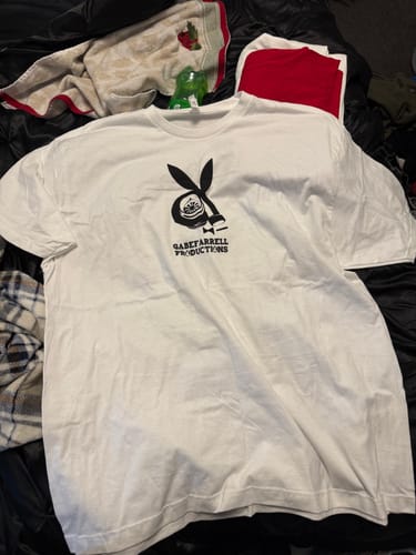 Reviewer's white t-shirt with a black 'Gabe Farrell Productions' bunny logo from the Red Rocket Mystery Box.