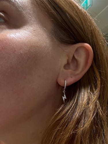 Customer photo review of Talitha Crystal Silver Lightning Bolt Huggie Earrings