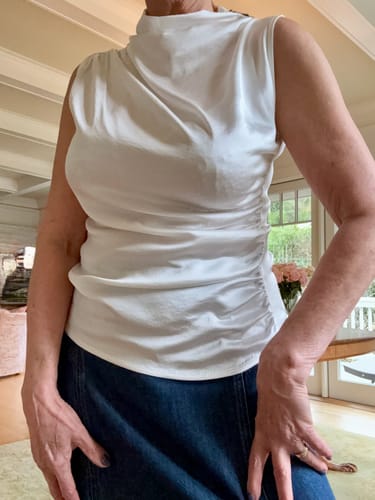 Reviewer in a size L Allegra Draped Satin Sleeveless Top, showing the draped neck and ruched side.