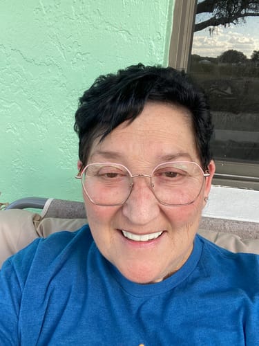 Reviewer smiling in a close-up photo, showcasing her bright Pop On Veneers.