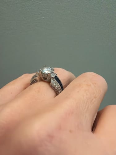 Customer photo review of Round Moissanite And Emerald-Cut Sapphire Channel Set Milgrain Engagement Ring