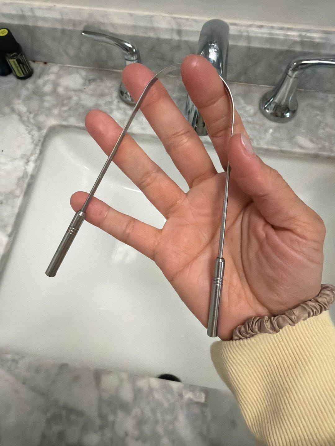 Customer photo review of Stainless Steel Tongue Scraper – Ayurvedic Oral Detox Tool for Fresh Breath & Bad Breath Relief