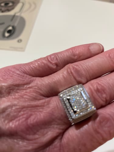 A customer holds the sparkling, stone-covered ICE BLOX RING in the palm of their hand.