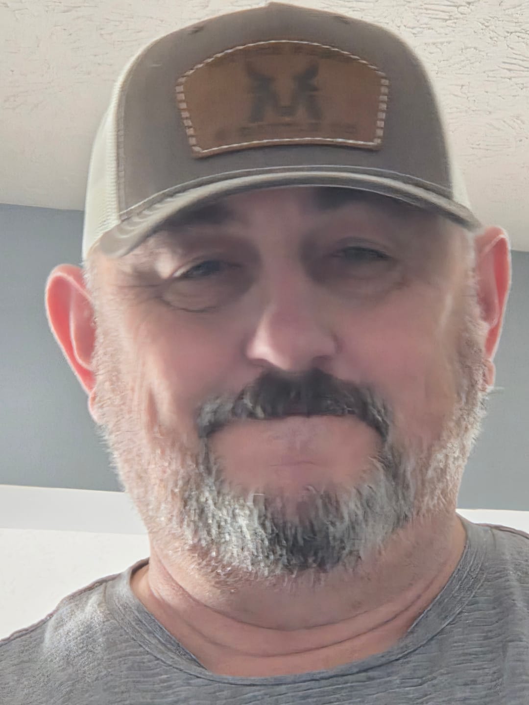 Customer photo review of McBee Farms Leather Patch Trucker Hat