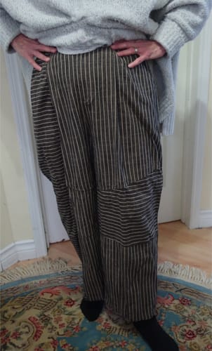 Reviewer standing with hands on hips, wearing the vintage plaid linen straight pants with a patchwork pattern.