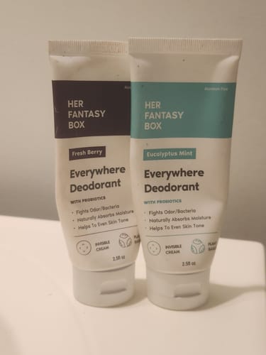 Reviewer's two tubes of Everywhere Deodorant in Fresh Berry and Eucalyptus Mint scents standing on a counter.