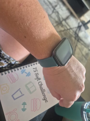 Reviewer wearing the Gard Pro Health Smartwatch 3 on their wrist, showing its dark teal band.