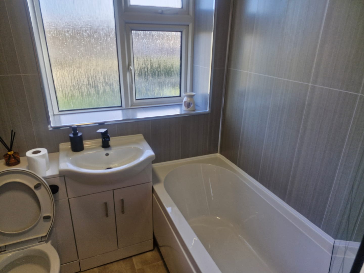 Customer photo review of 8mm Seagrass Large Tile Effect Bathroom Wall Panel 2.6M