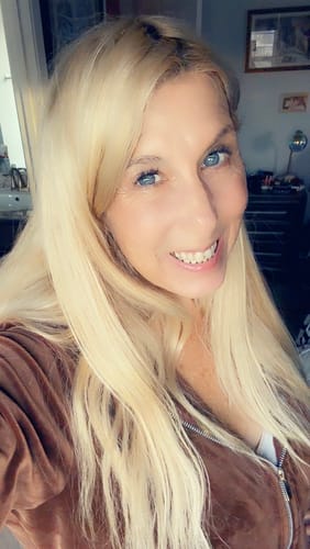 Reviewer shows their clear, natural-looking skin after applying Neptune Grass Fed Tallow Sunscreen.