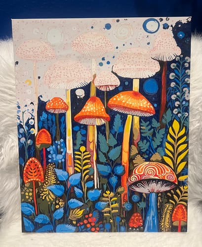 Reviewer's Enchanted Mushroom Forest paint by numbers kit, shown partially completed with vibrant colors.