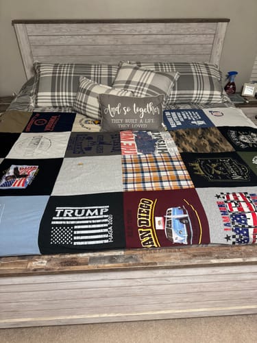 Customer's memorial Premium T Shirt Quilt, made from her late father's shirts, spread neatly on a bed.