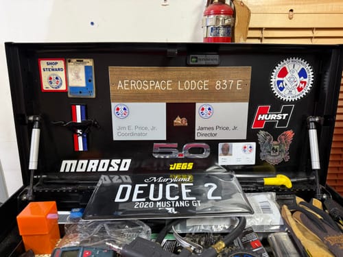 Customer's custom Maryland Blackout Metal License Plate for a Mustang GT displayed in a toolbox.