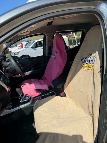 Customer's pink and tan Waterproof Car Towel Seat Covers on the front seats of a car.