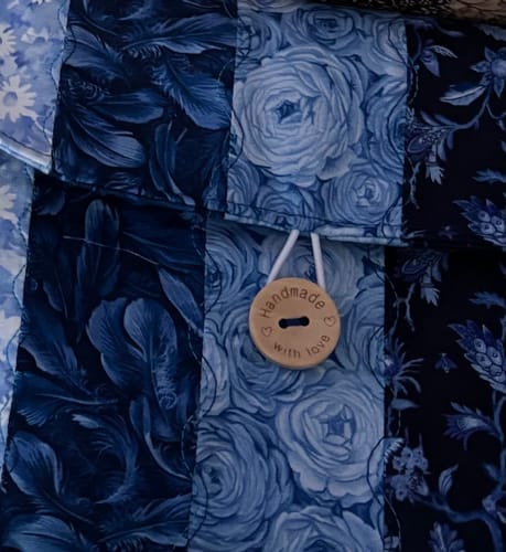 Customer's close-up of a blue quilted project with decorative stitching, made using Singer twin needles.