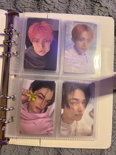 Customer's STANDARD A5 POCKET PAGES inside a white binder holding four K-pop photocards.