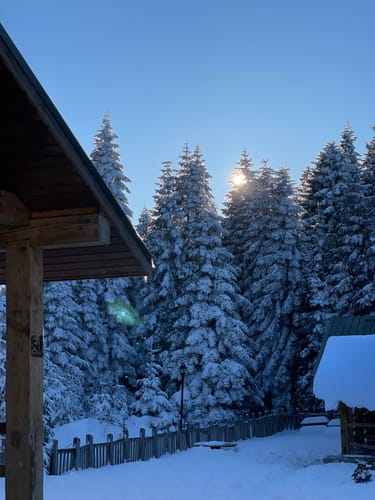 Reviewer's photo of a snowy cabin edited with Ski Resort Luxury Presets, showing clean colors and detailed shadows.