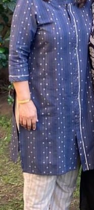 Reviewer wearing the Navy Blue Dress Material, stitched into a polka-dot kurta and striped pants.