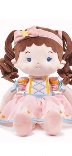 Customer's Personalized Princess Twinkle doll with brown pigtails and a pink dress, sitting upright.