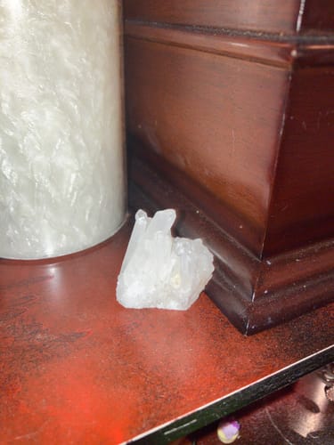 Customer's clear crystal from the VIP Crystal Club sitting on a dark wooden surface.