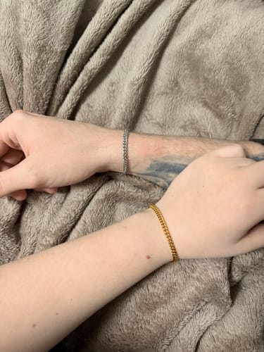 Customer showing two CLEAN CUBANA BRACELETS being worn, one in a silver finish and one in a gold finish.