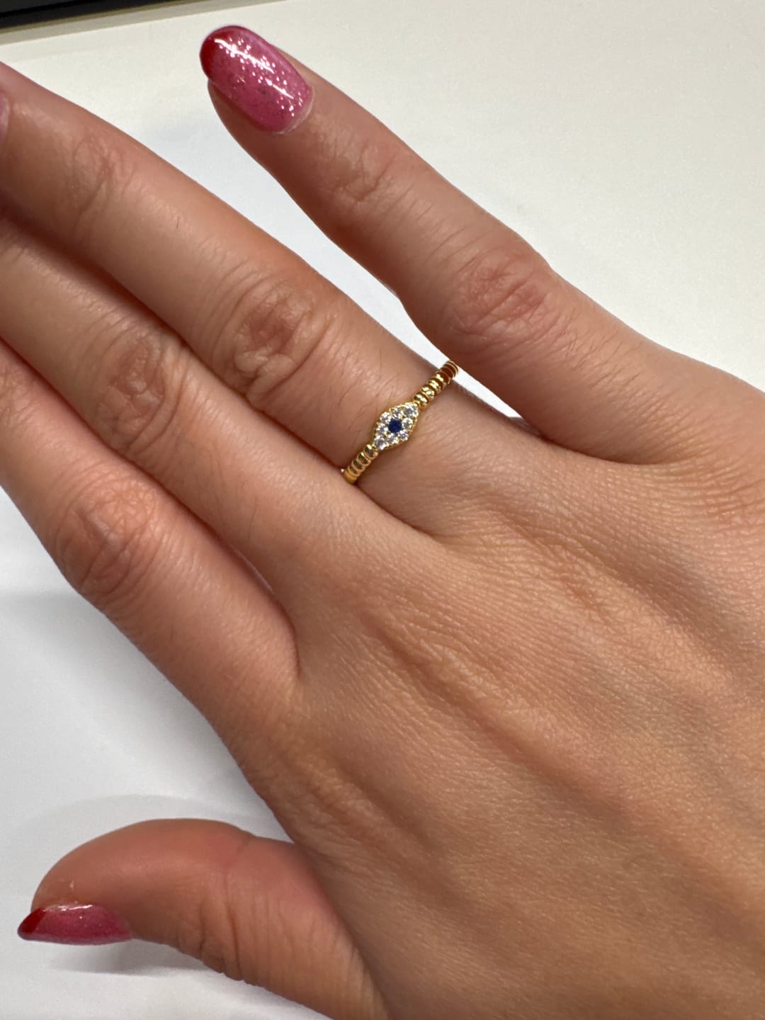 Customer photo review of Anillo Bolitas Con Ojo Azul Zirconias