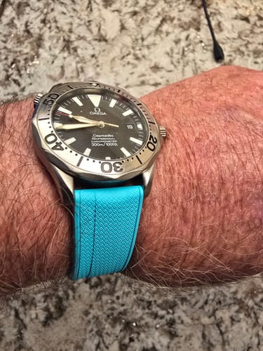 Reviewer's turquoise Shark Skin Rubber strap on a silver Omega Seamaster watch.