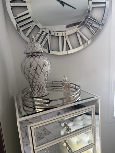 Customer's silver and white ginger jar displayed on a mirrored dresser in their bedroom.
