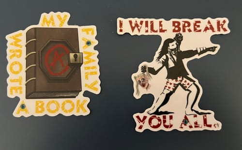 Customer's two Custom Sample Stickers with unique graphic designs and white outlines.