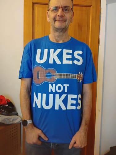 Reviewer wearing the blue 'Ukes Not Nukes' T-Shirt.