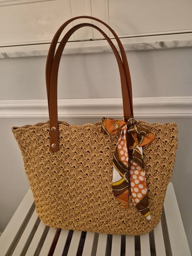 Customer's completed Aveline crochet Shoulder Bag, a light brown tote with leather straps and a patterned scarf accent.