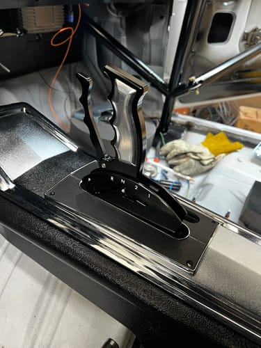 Close-up of a customer's Powerglide Billet Shifter installed in a car's center console.