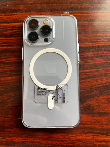 Customer's Anti Yellow Magsafe Transparent Clear Case on an iPhone, showing the back with the MagSafe ring and protective film.