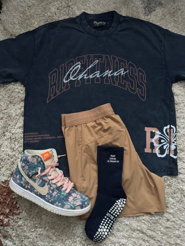 Customer's flat lay of the "Ohana Forever" Vintage Wash Tee with matching shorts, socks, and floral-patterned sneakers.