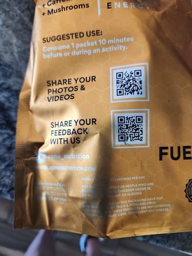 Reviewer's close-up of the back of the SuperCharged Honey packaging, showing the suggested use and QR codes.