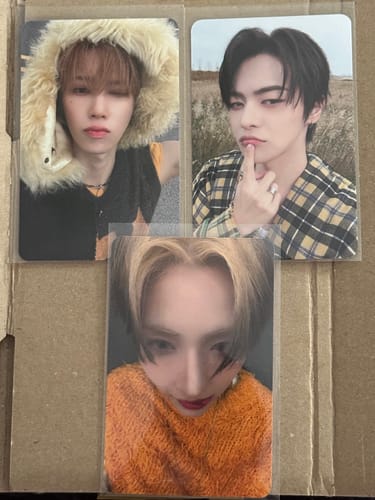 Customer displays three different ALPHA DRIVE ONE "EUPHORIA" jewel case version photocards received in their order.