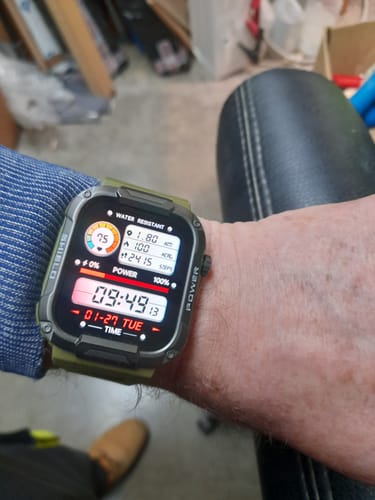 Customer wearing the Gard Pro Ultra smartwatch with a green strap, showcasing the detailed digital display on their wrist.