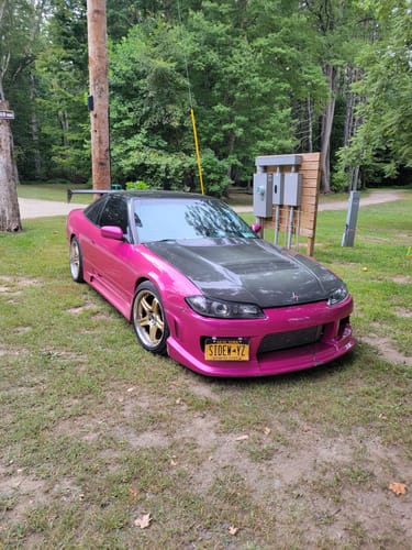 Reviewer's photo of their vibrant pink sports car shared in a review for the TCG90 MYSTERY CASH BOX.