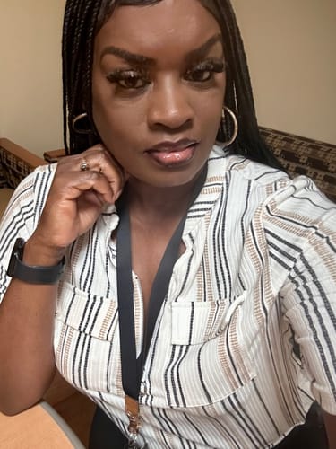 Reviewer's selfie showing their beautiful unit, which is styled in long, black braids.