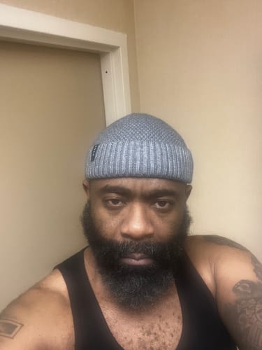 Customer photo review of LOGO RIBBED FISHERMAN BEANIE.