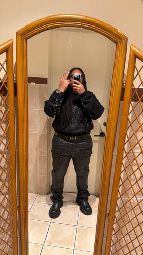 Customer's mirror selfie wearing the Vintage Butterfly & Star Studded Punk Belt with an all-black, edgy outfit.