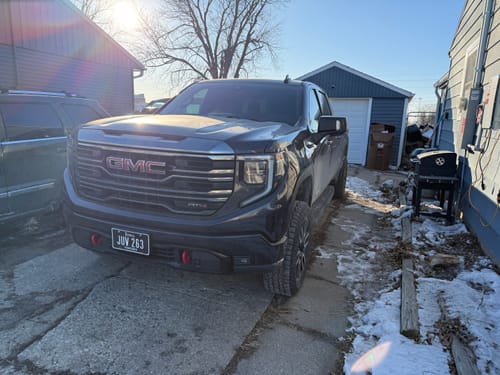 Customer's GMC Sierra truck after installing 2" Hubcentric Wheel Spacers, showing a wider, aggressive stance.