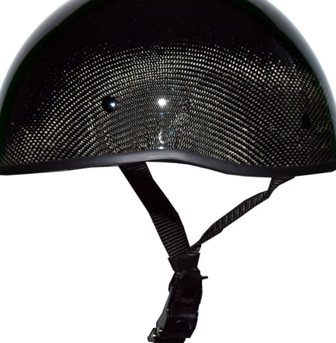 Customer's shiny Natural Forged SOA helmet, showing the detailed carbon fiber weave and black quick-release strap.