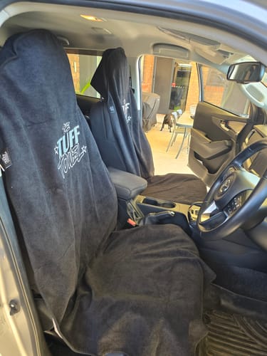 Customer's black Waterproof Car Towel Seat Covers fitted on the driver and passenger seats of a car.