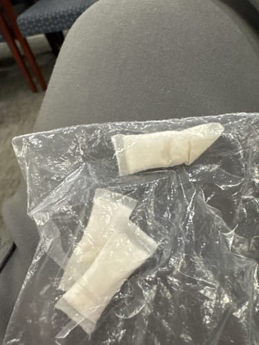 Reviewer showing how they carry their Mountain Wintergreen Nicotine Pouches in a small plastic bag.