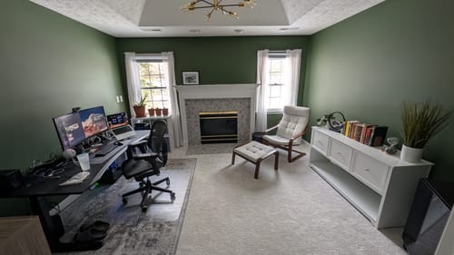 Customer's home office featuring walls painted with the deep green Midnight Garden color.