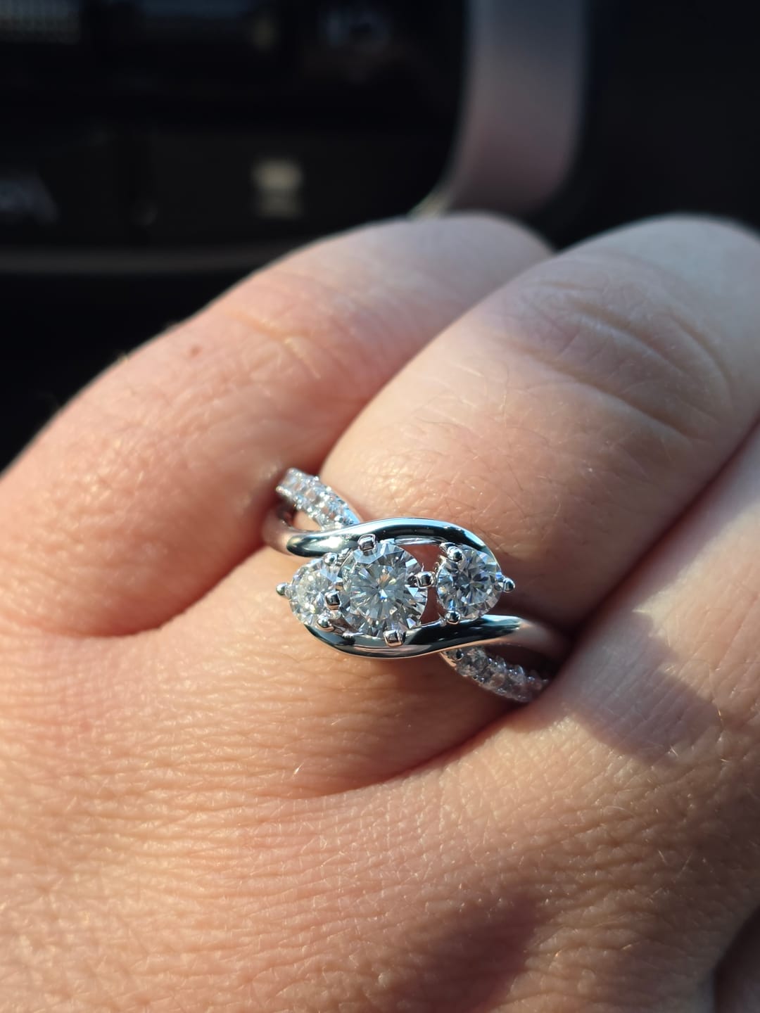 Customer photo review of Swirl Three Stone Moissanite Twisted Pave Engagement Ring